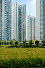 huge residential building complex, green court betweern high-rise apartment buildings