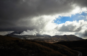 Scenery of Mount Aso actively blowing up volcanic smoke. View Smoke Gas Steam. Shot in Aso-Kuju National Park, Kumamoto,Japan.
