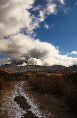 Scenery of Mount Aso actively blowing up volcanic smoke. View Smoke Gas Steam. Shot in Aso-Kuju National Park, Kumamoto,Japan.