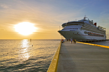 Modern family fun cruiseship cruise ship liner Sunshine in Grand Turk with pier, people and...