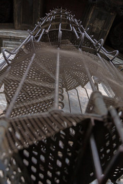 Circular iron staircase at St. Isaac's Cathedral on a winter cloudy day.