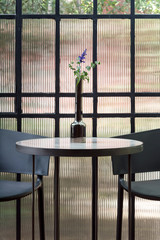 Modern sunroom with black chairs