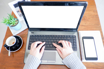 Cropped shot view of business woman’s hands typing the labtop with blank copy space screen for your information content or text message.