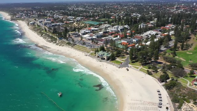 4k Smooth drone footage over beautiful Cottesloe beach in Fremantle, Perth Australia on a warm summer day