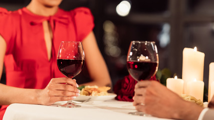 Unrecognizable Couple Holding Glasses Having Dinner In Restaurant, Panorama, Cropped
