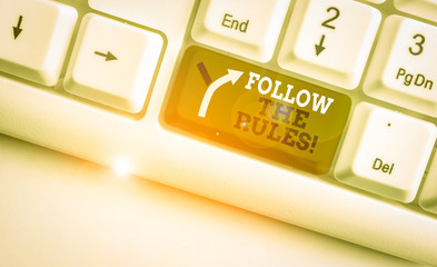 Writing note showing Follow The Rules. Business concept for go with regulations governing conduct...