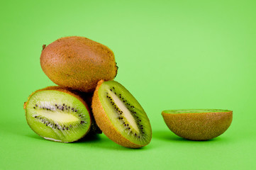Kiwi fresh and juicy large shot on a bright green background.