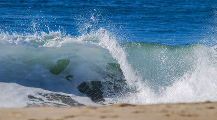 Rolling Wave Crashing on Beach