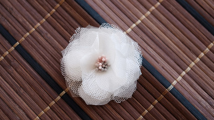 Handmade white flowers made out of floral cloth or blossom fabric. These handicraft floral white with petal pistil are great for DIY project and handicraft collections.