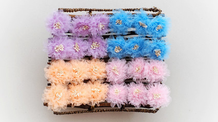 Handmade pastel flowers made out of tulle fabric flowers. This tulle fabric cloth blossom is great for handicraft DIY project collection.
