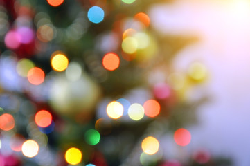 Festive christmas background. Garland lights on the Christmas tree. Blur, out of focus