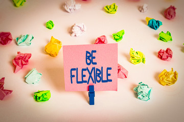 Writing note showing Be Flexible. Business concept for able to be easily modified to respond to...