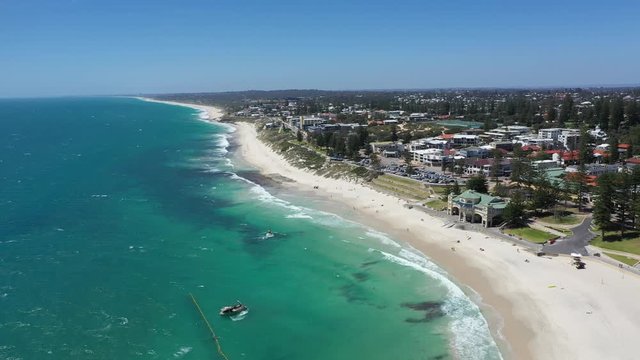 4k Smooth drone footage over beautiful Cottesloe beach in Fremantle, Perth Australia on a warm summer day