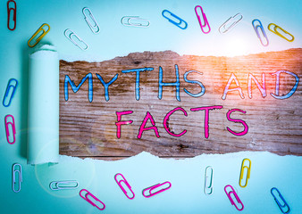 Writing note showing Myths And Facts. Business concept for Oppositive concept about modern and...