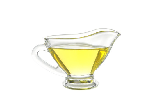 Gravy boat with olive oil isolated on white background