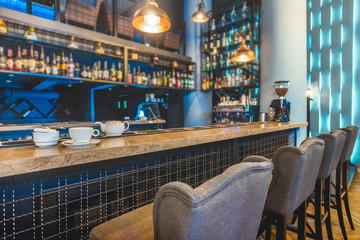 Stylish restaurant in a loft style with creative walls, textured bar rack