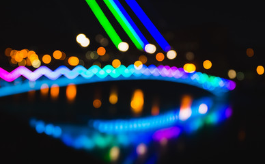 Abstract defocused background of colorful city lights at night.