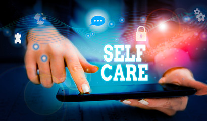 Writing note showing Self Care. Business concept for the practice of taking action to improve one s...