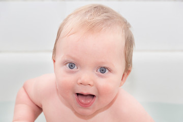 portrait of the cute infant in the bath