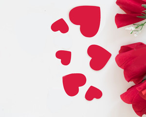 Romantic red color and valentines hearts symbolize a greeting of love .