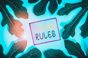 Writing note showing Golden Rules. Business concept for basic principle that should always follow to ensure success