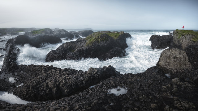 Big stones in the ocean seaside in stormy environment in Ballintoy