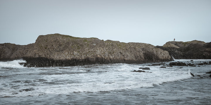 Big stones in the ocean seaside in stormy environment in Ballintoy