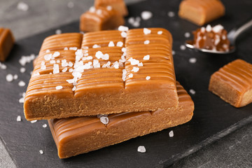 Salted caramel on slate board, closeup view