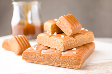 Salted caramel on white table, closeup view