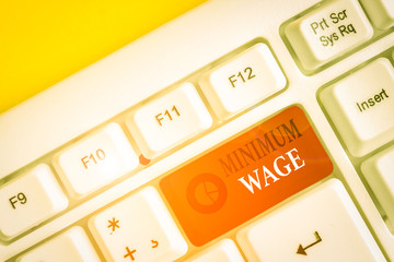 Text sign showing Minimum Wage. Business photo showcasing the lowest wage permitted by law or by a...