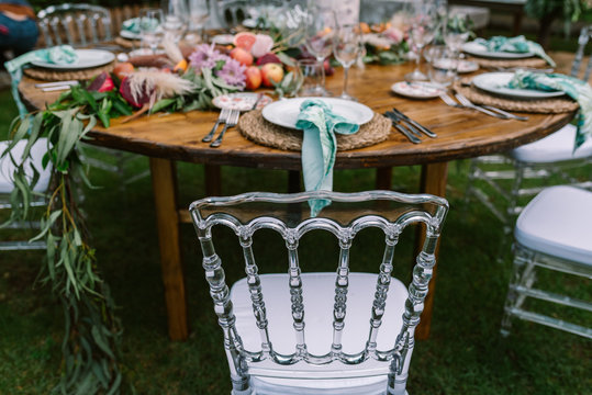 Wedding table decoration in rustic style placed outdoors