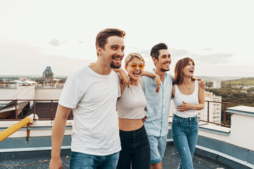 Group of friends enjoying outdoors at roof