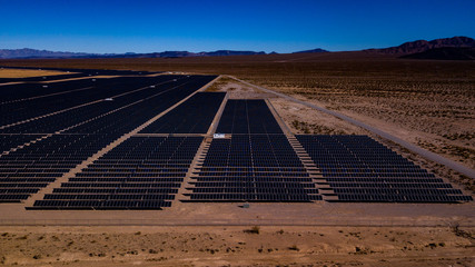 Aerial photos of Solar Farm in Desert with mountains in background