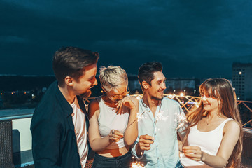 Friends enjoying a rooftop party