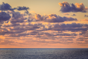 Obraz premium Sunset over Tyrrhenian Sea on Sicily Island, Italy - view from Zafferano cape