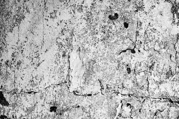Texture of a concrete wall with cracks and scratches which can be used as a background
