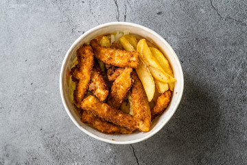 Take Away Fish and Chips made with Breaded and Fried Seabass in Plastic Box Package / Container.