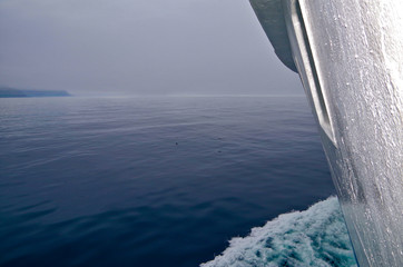 Magic and mystical scenery and coastal landscape with fog and mist over the sea and water during...