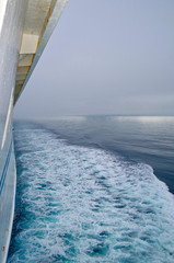 Magic and mystical scenery and coastal landscape with fog and mist over the sea and water during...