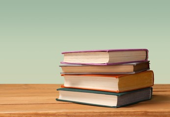 Collection stack of old retro books on background