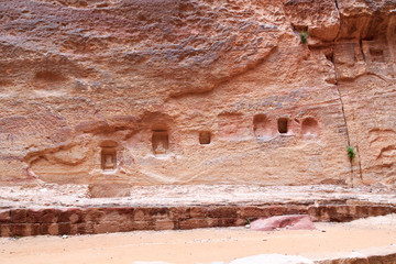 Niche containing sacred stone Baetyl at gorge canyon Siq in ancient city of Petra in Jordan