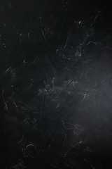 Black with Gray concrete texture or background. With place for text and image.