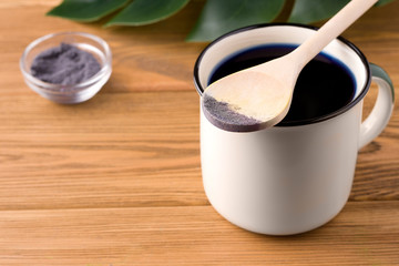 blue matcha tea on a wooden background. rustic concept. have copy space