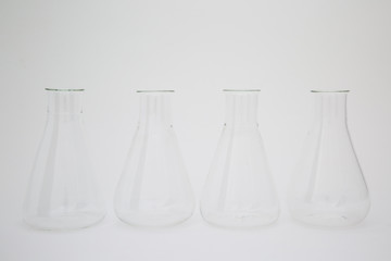 Group of scientific laboratory glass erlenmeyer flask isolated on white background