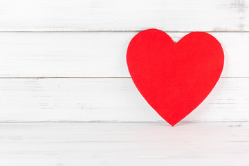 Red Heart Shaped on white wood background. Love Concept with Copy Space.