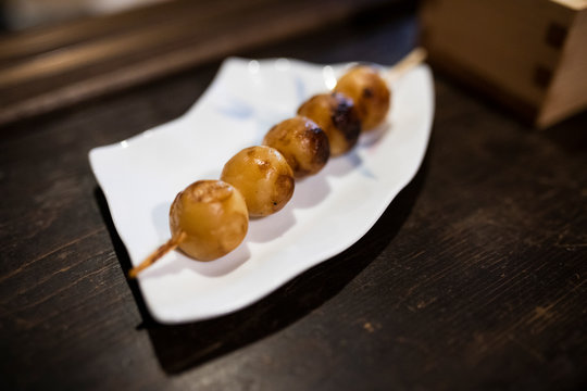 Japan, Takayama, Mitarashi dango appetizer served in traditional Japanese restaurant