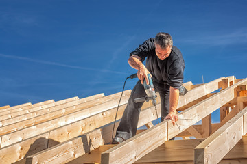 Carpenter at Work, Fixing a Rafter with a Long Screw