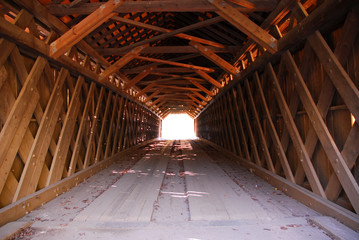 Inside a covered bridge, old wooden timbers