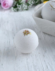 Beautiful spa cosmetic composition. Close up bath bomb on white background. Love or health lifestyle concept