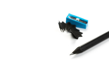 Black graphite pencil triangular shape with sharpener isolated